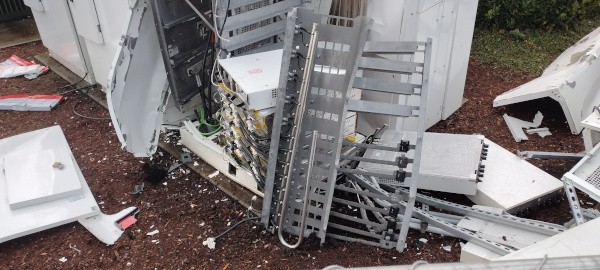 picture of a completely destroyed part of a tesla charging station